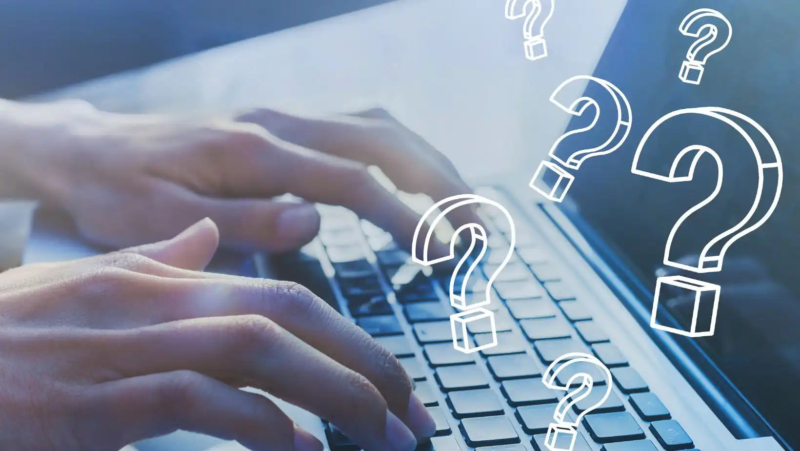 Hands typing on a laptop with question marks.